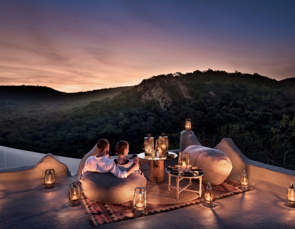 Couple enjoying a luxury private villa overlooking the ocean