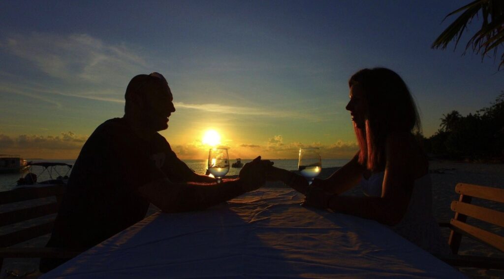 Maldives infinity pool villa at sunset overlooking the Indian Ocean