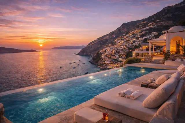 Luxury villa with infinity pool overlooking Positano on the Amalfi Coast at sunset