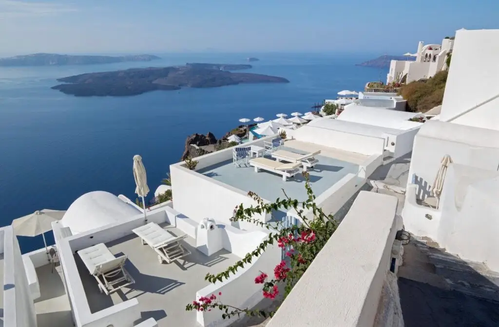 Luxury cliffside villas in Imerovigli Santorini overlooking the caldera and Aegean Sea.