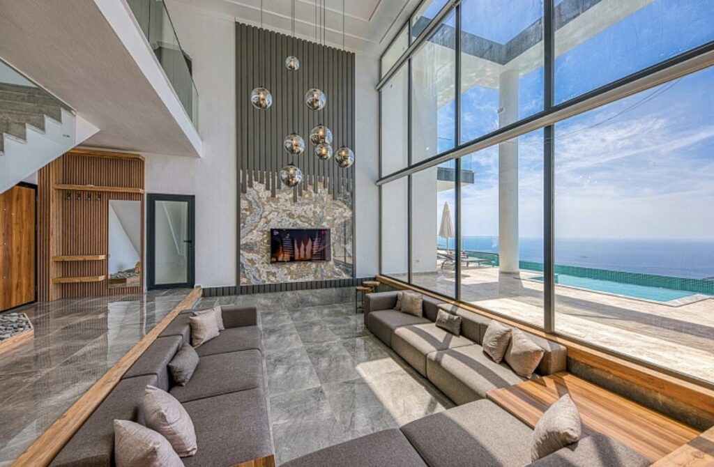 Luxury villa interior with open living space and panoramic views.