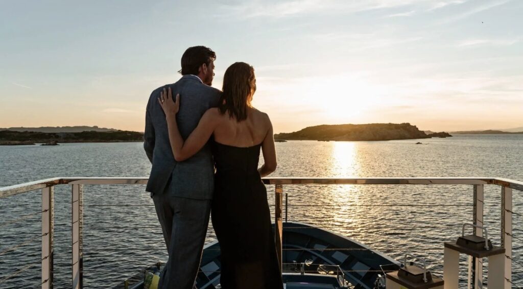 Couple enjoying a luxury Mediterranean travel experience with ocean views.