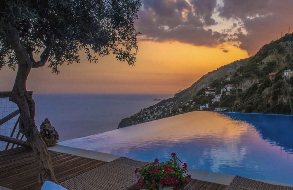 Luxury Villa on the Amalfi Coast with infinity pool and sea view at sunset.